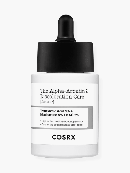 The Alpha-Arbutin 2 Discoloration Care Serum in branded white bottle with  black pipette applicator on light gray background